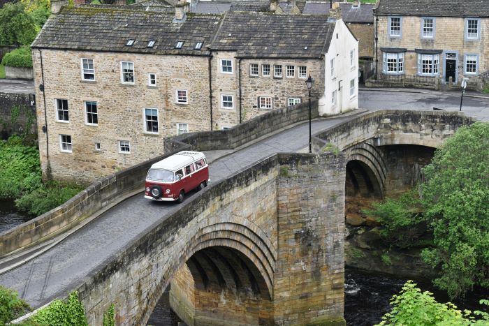 A VW camper van crossing a bridge at Barnard Castle.