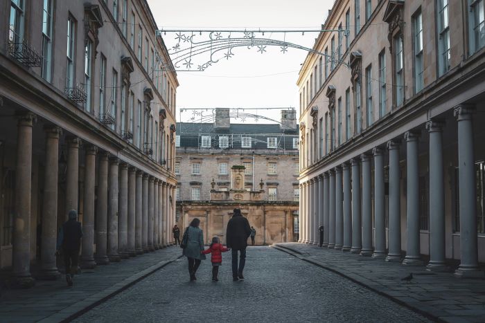 A family walking through the streets of Bath