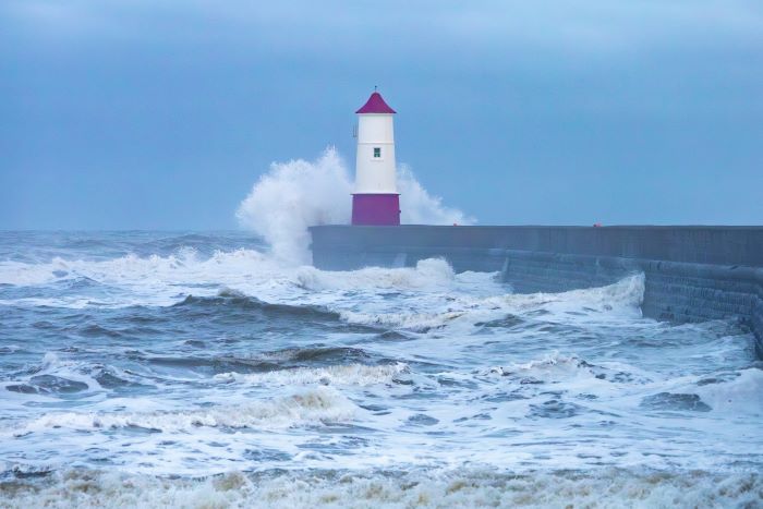 Waves splashing against a lighthouse
