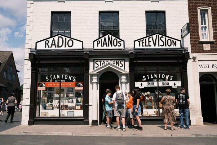 A group of people standing at the Black Country Living Museum