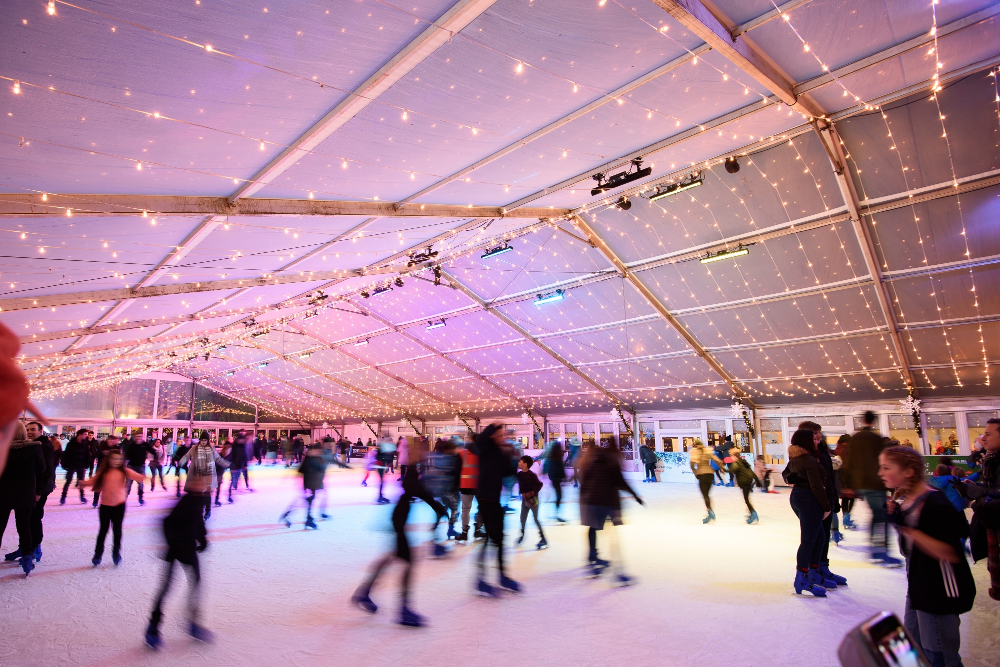 People skating around cardiff ice rink