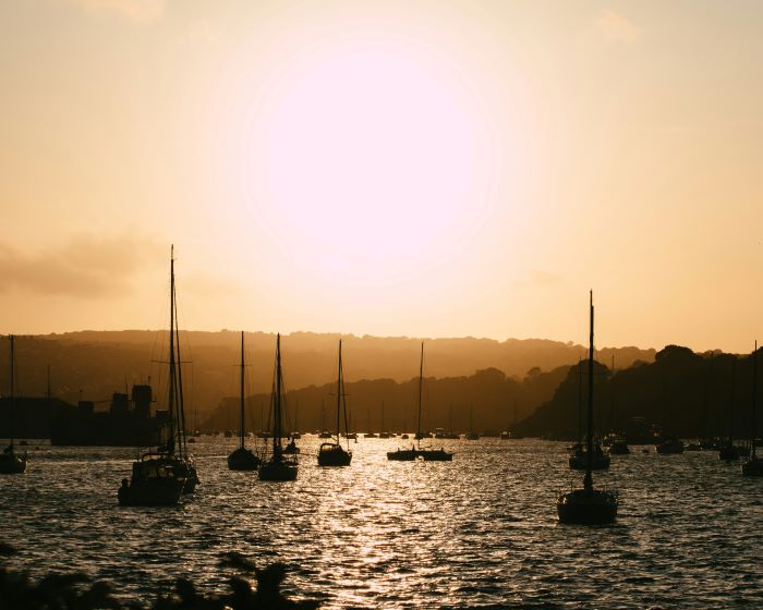 Boats on the water at sunset